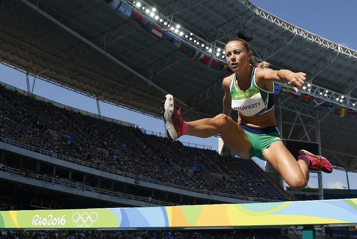 Kerry O’Flaherty Jumping over a Steeplechase Hurdle