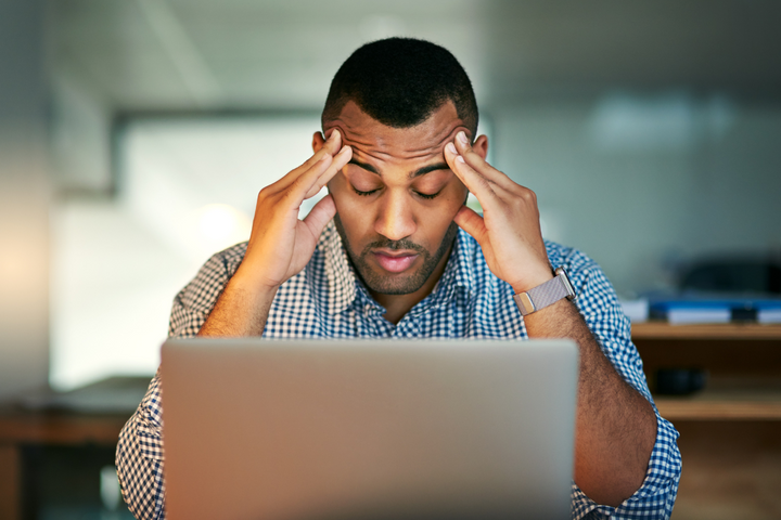 Managing Stress, man stressed out in front of the laptop