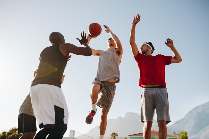 Men's Health Top 5 Health Conditions men playing basketball outdoors