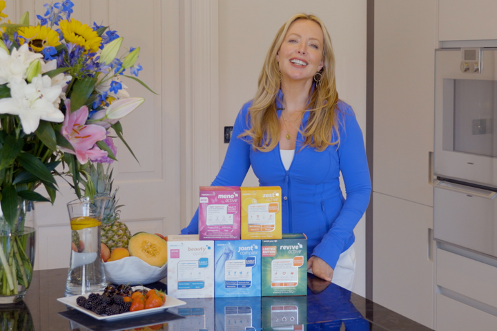 Tina Lond Caulk, Nutrition Consultant Revive Active Brand Ambassador in her kitchen with Revive Active Supplements